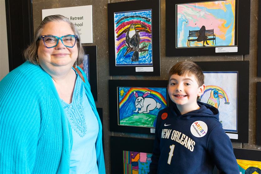 Students and their family at an art show